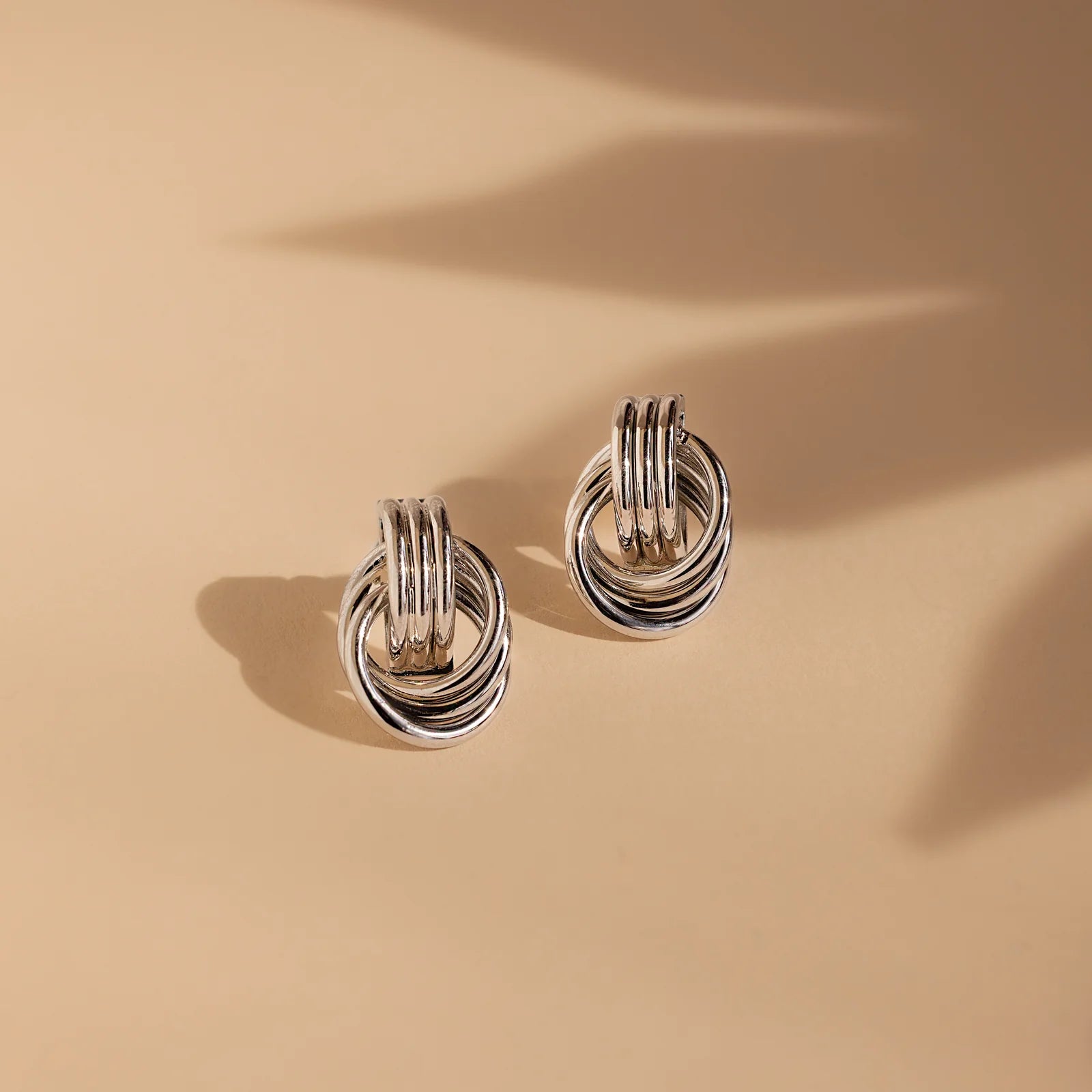 Knot earrings made of EVA foam.