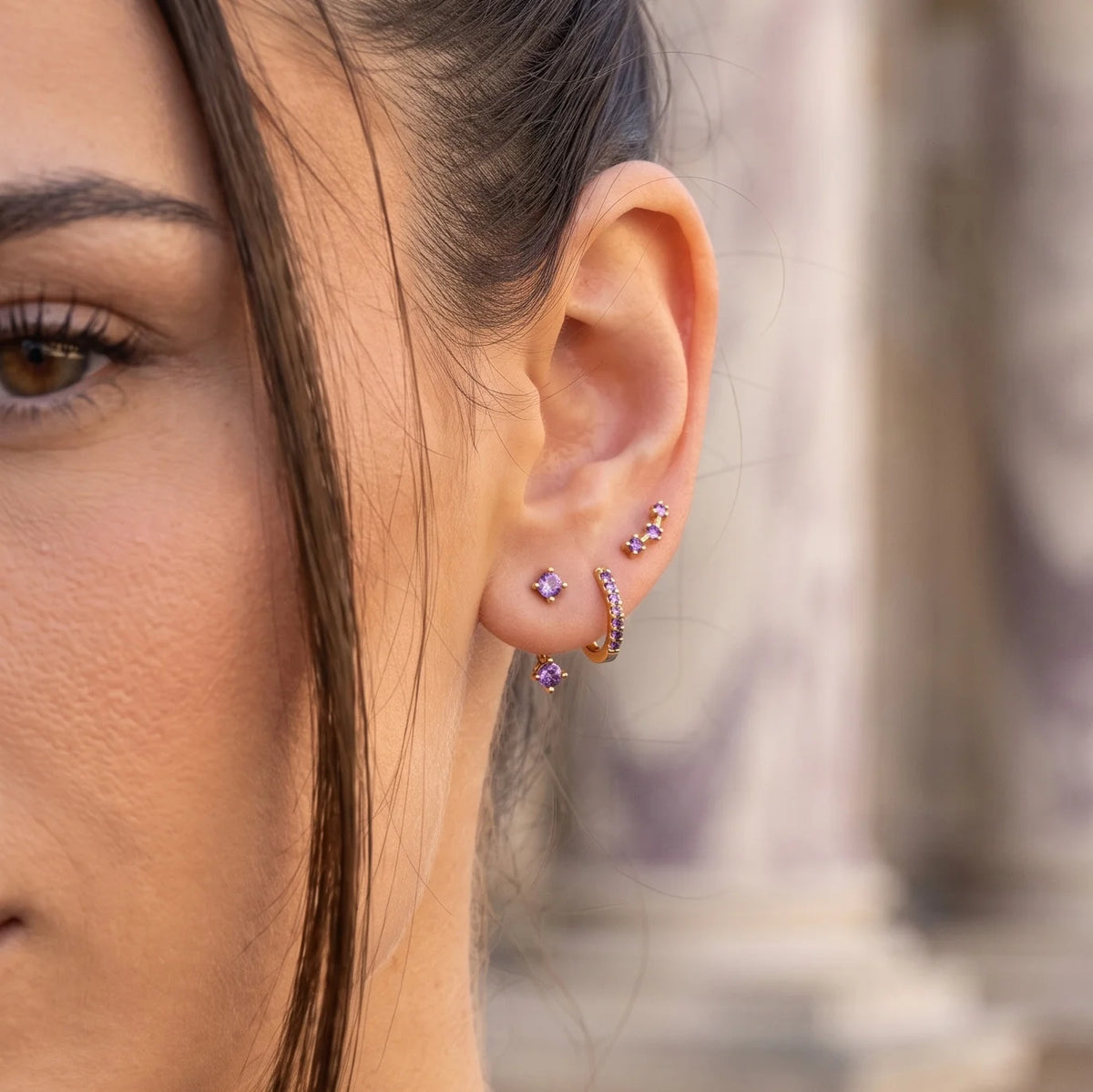 Set of colorful earrings with sparkling stones.