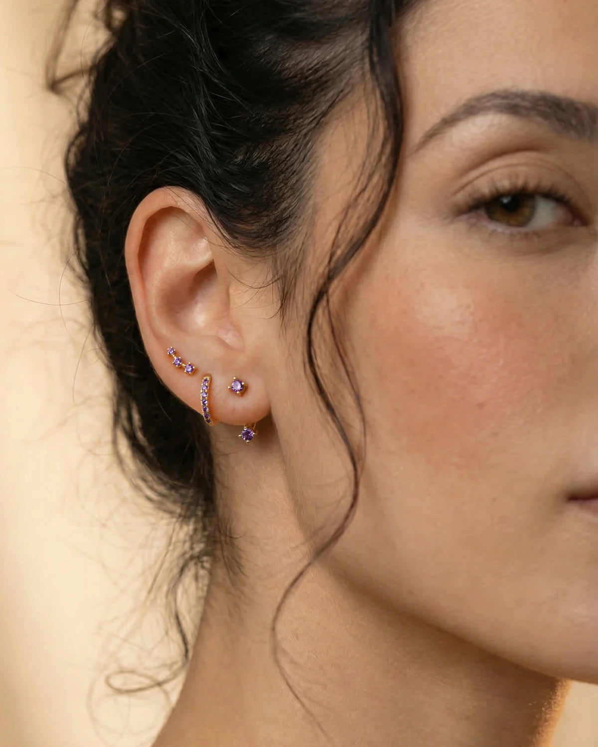 Set of colorful earrings with sparkling stones.