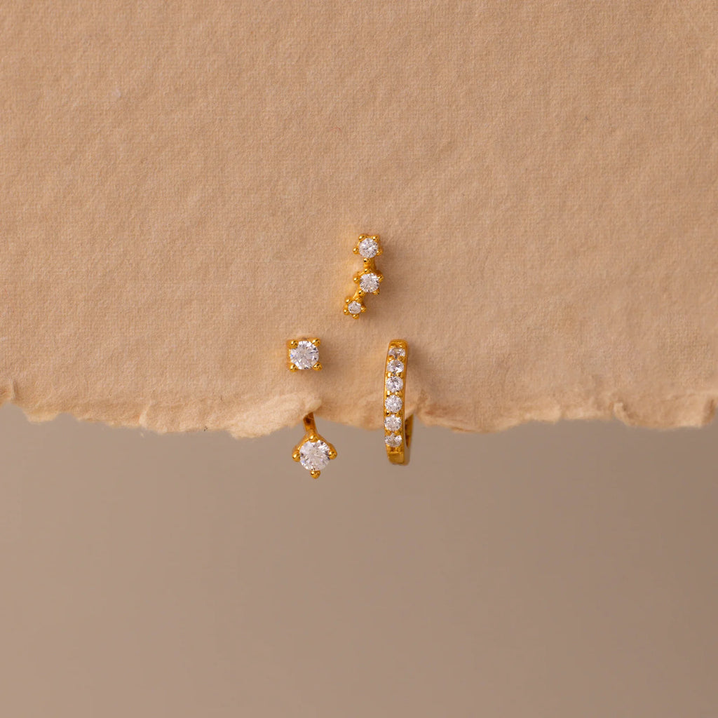 Set of colorful earrings with sparkling stones.