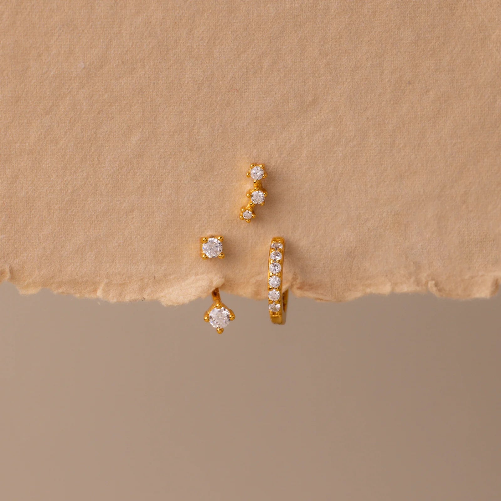 Set of colorful earrings with sparkling stones.