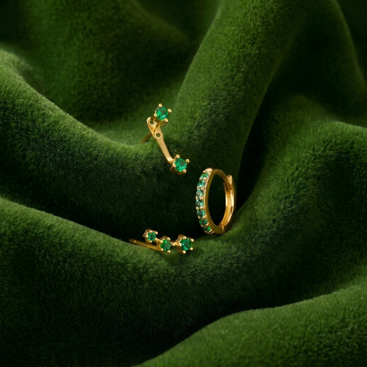 Set of colorful earrings with sparkling stones.