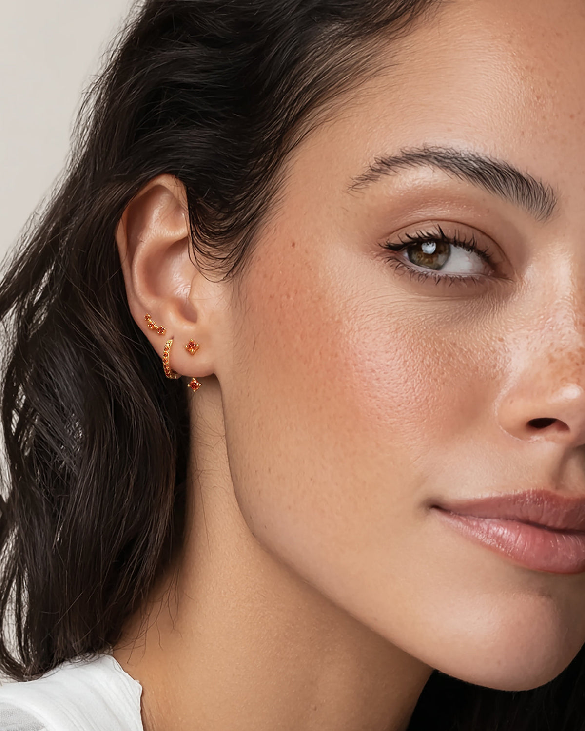 Set of colorful earrings with sparkling stones.