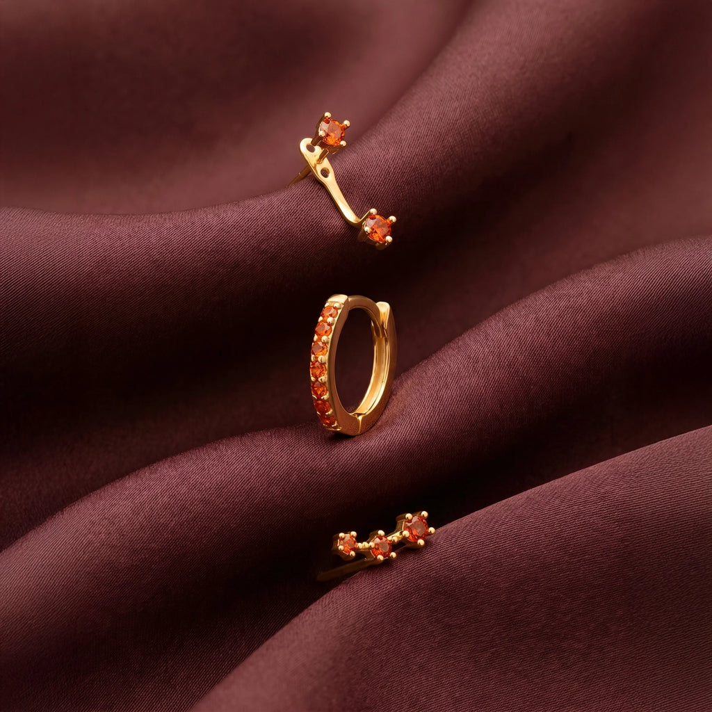 Set of colorful earrings with sparkling stones.