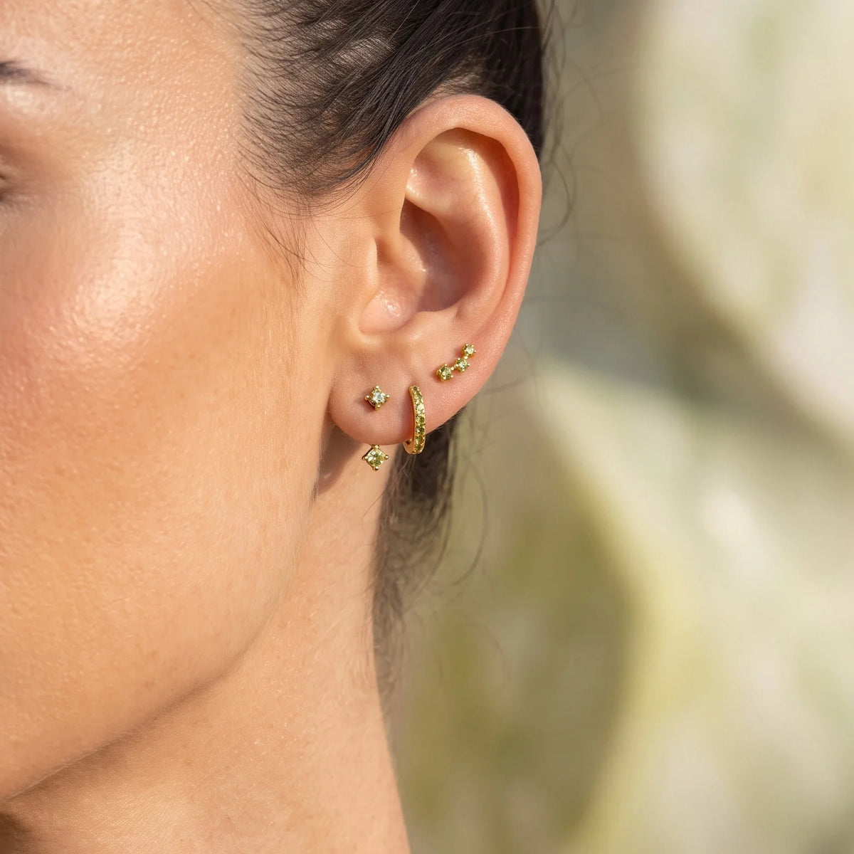 Set of colorful earrings with sparkling stones.