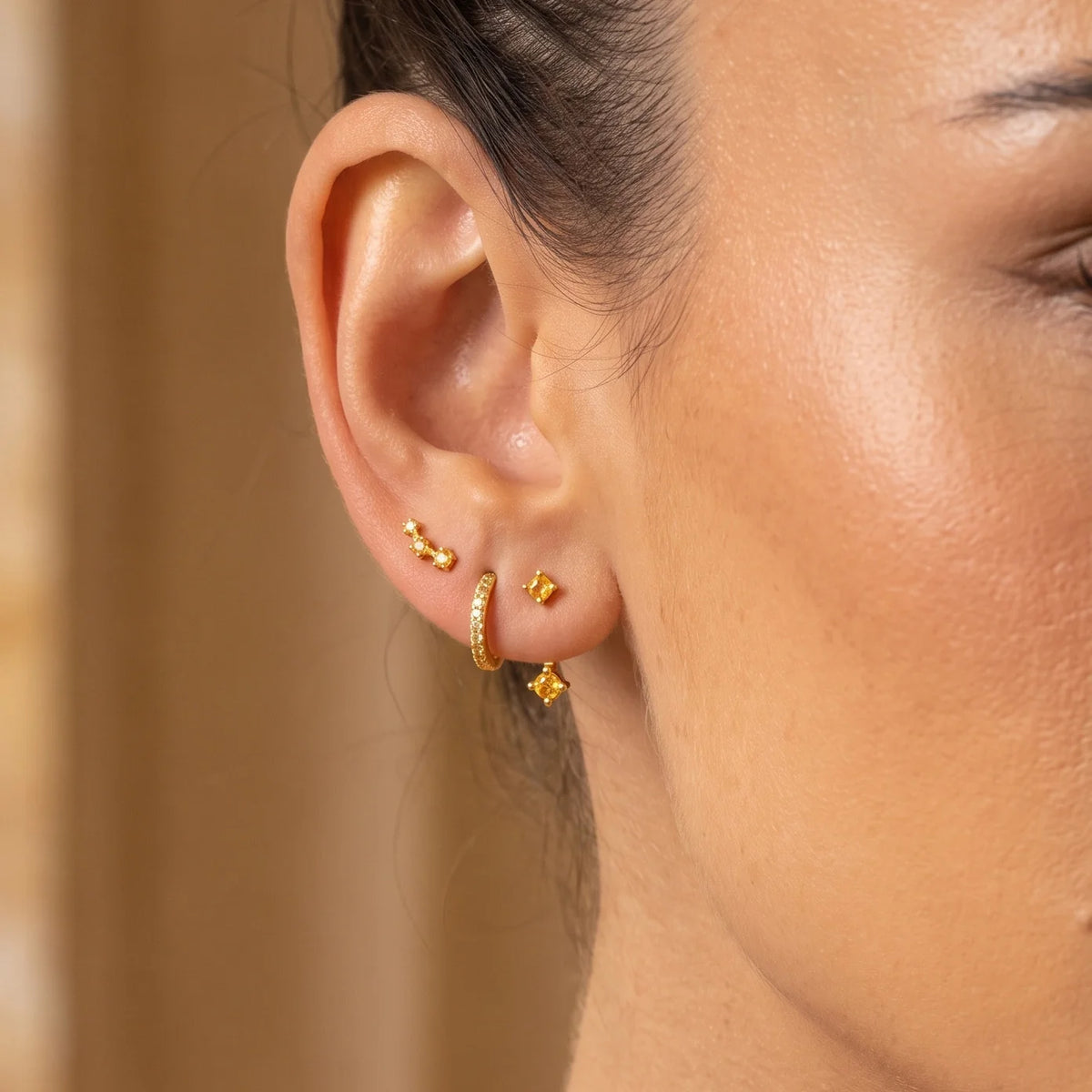 Set of colorful earrings with sparkling stones.
