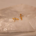 pavé earrings with a timeless symbol