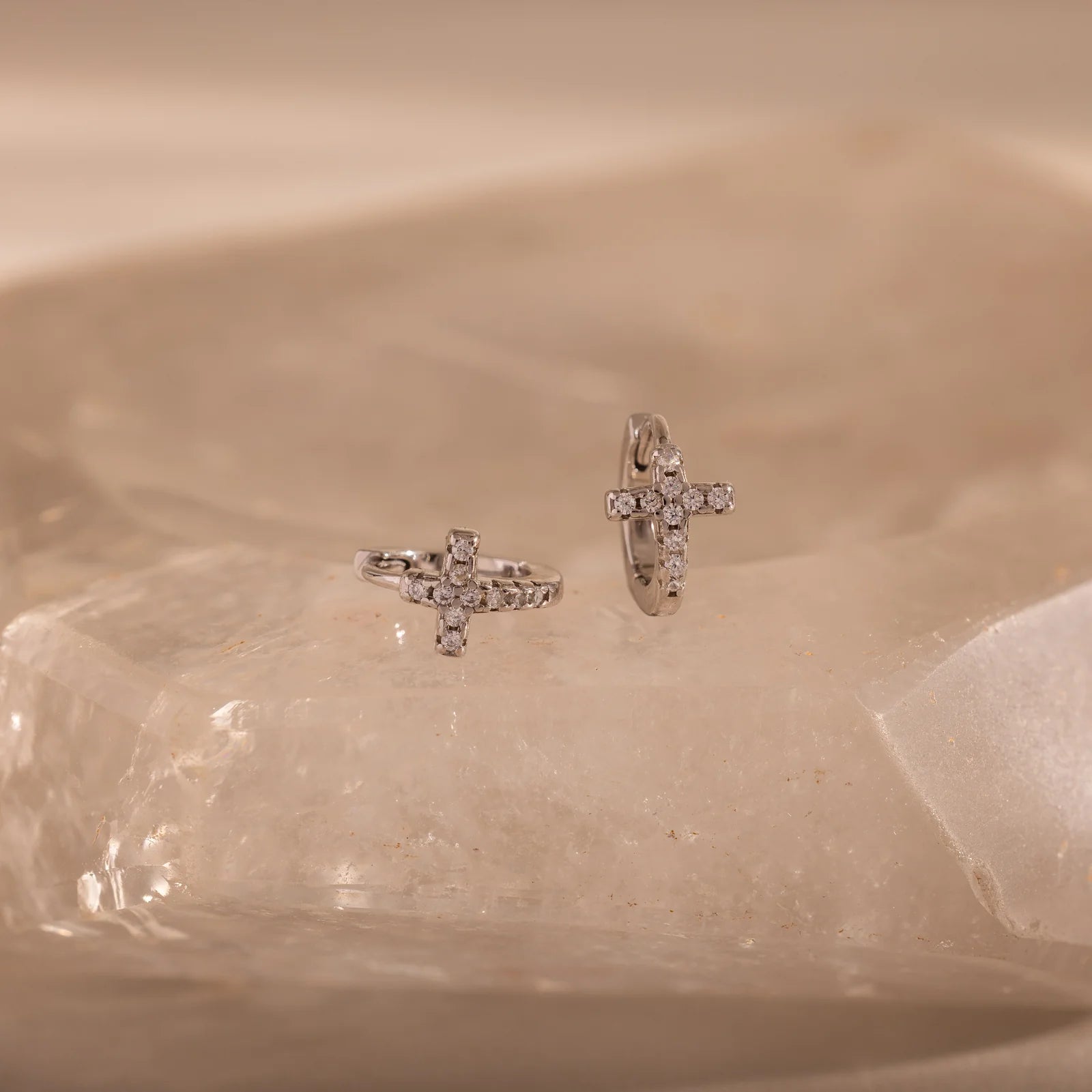 pavé earrings with a timeless symbol