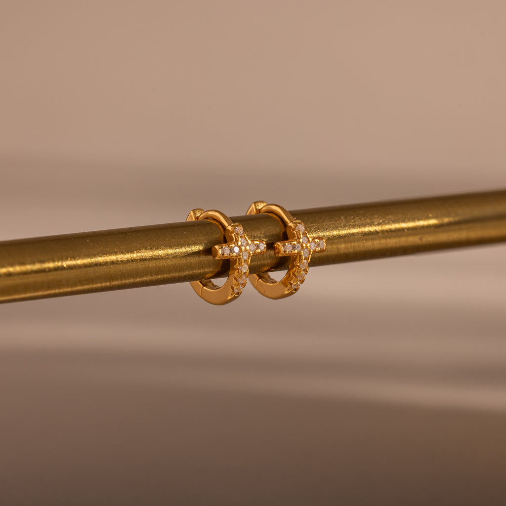 pavé earrings with a timeless symbol