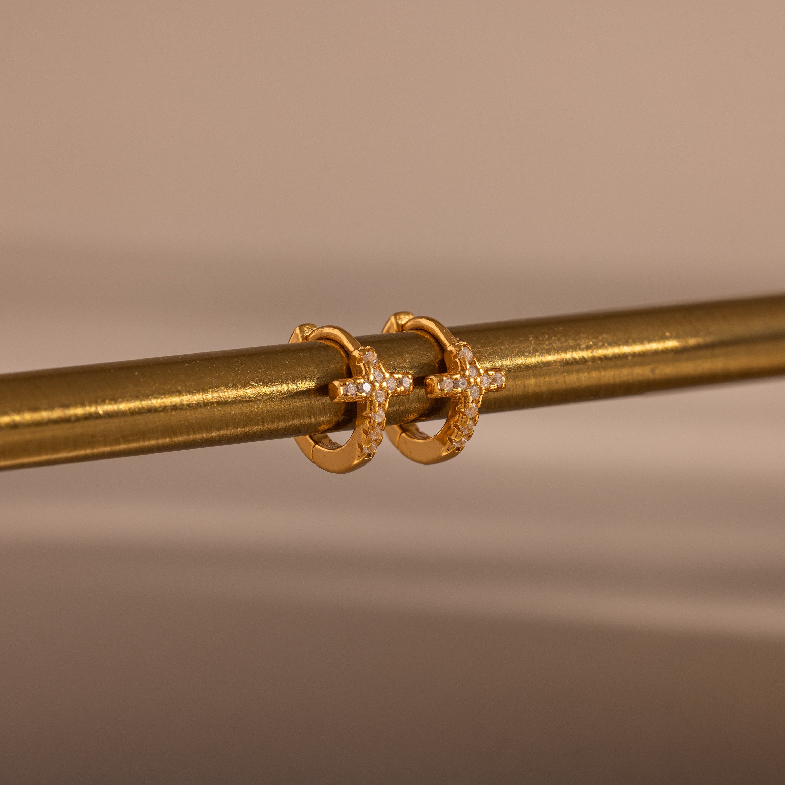 pavé earrings with a timeless symbol