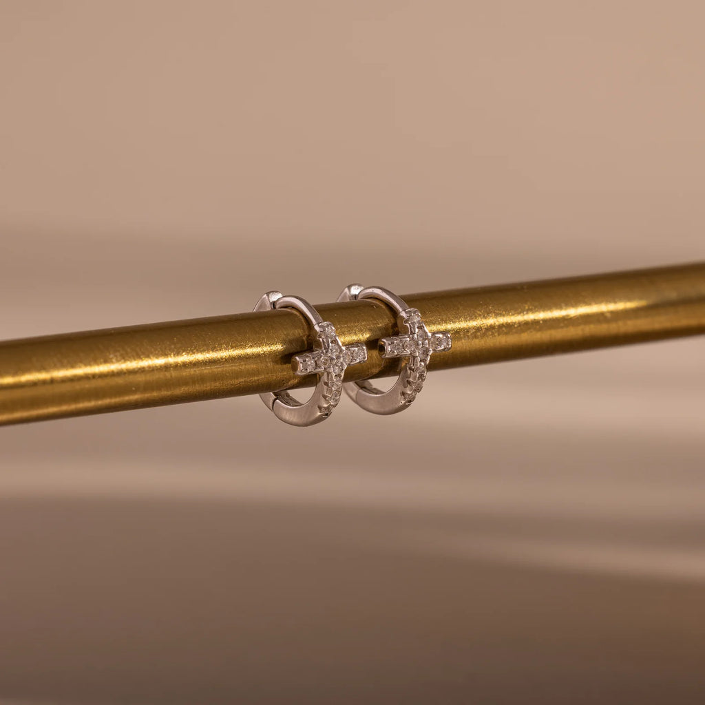 pavé earrings with a timeless symbol