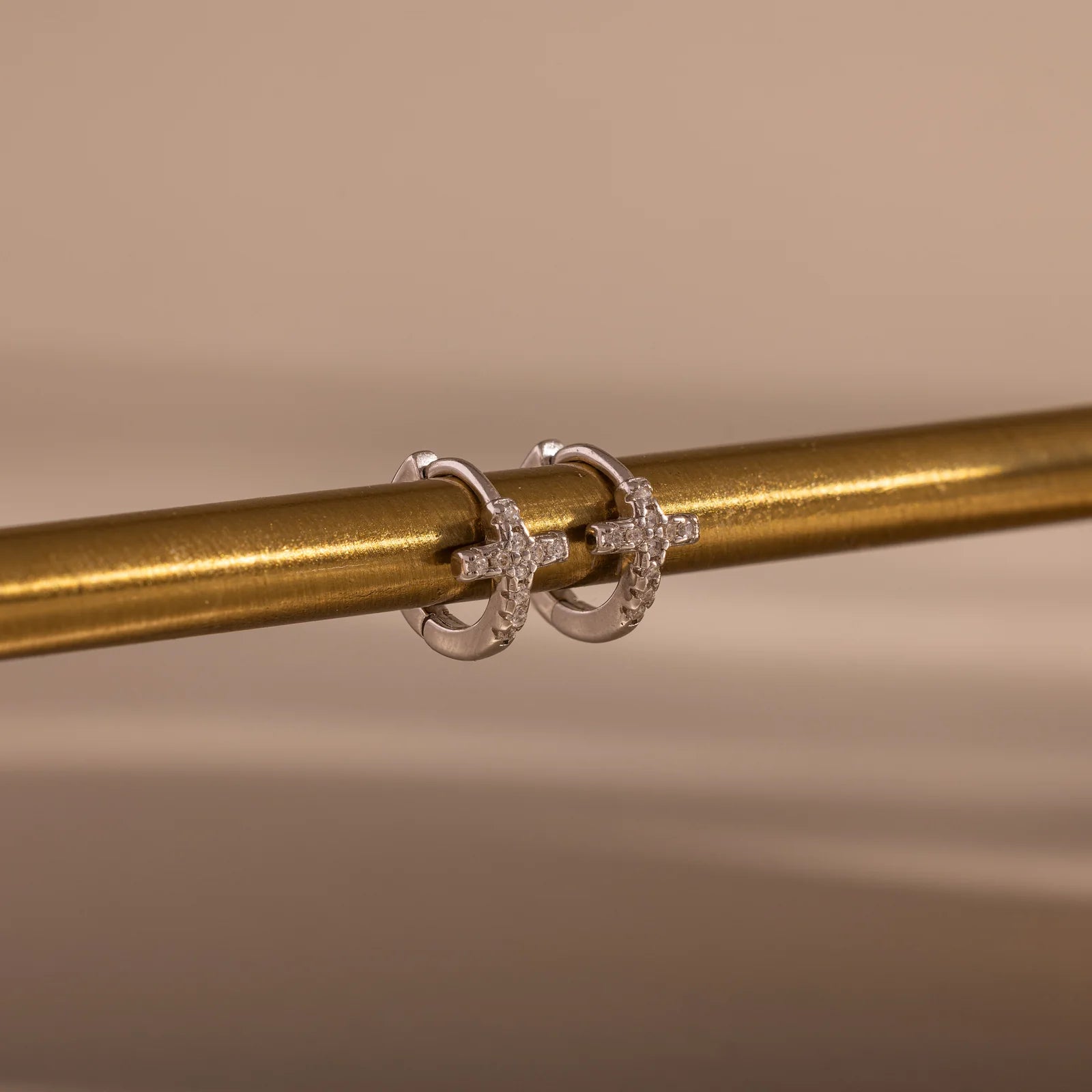pavé earrings with a timeless symbol