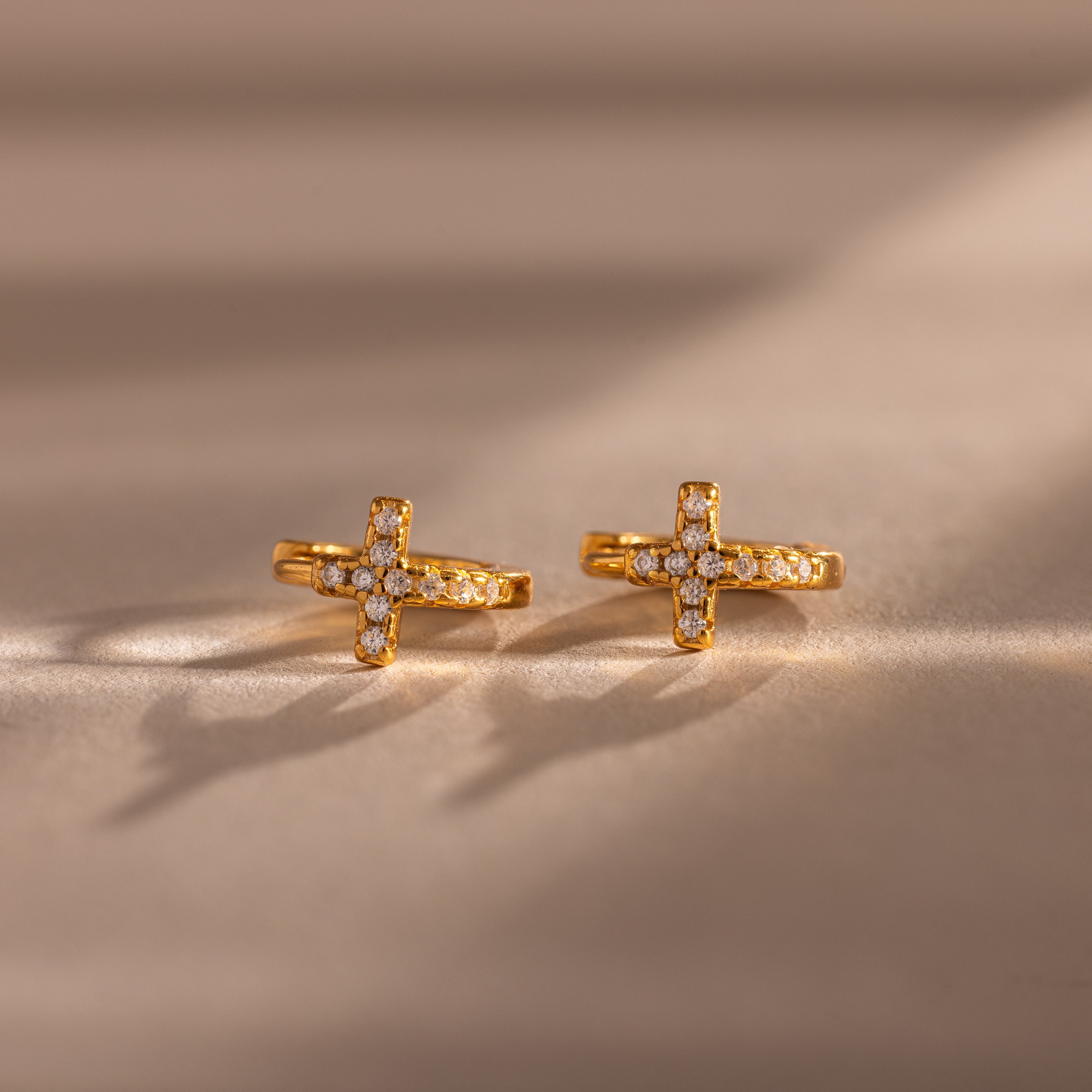 pavé earrings with a timeless symbol