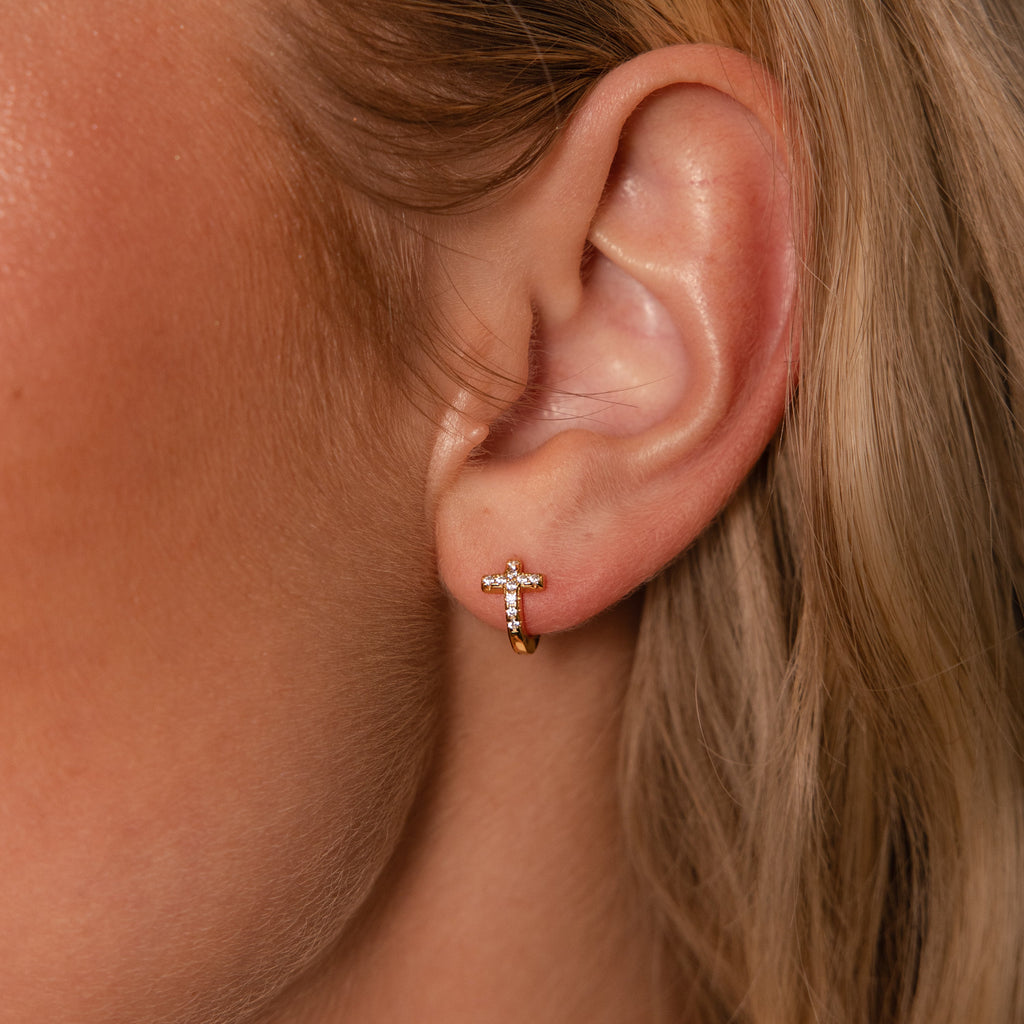 pavé earrings with a timeless symbol