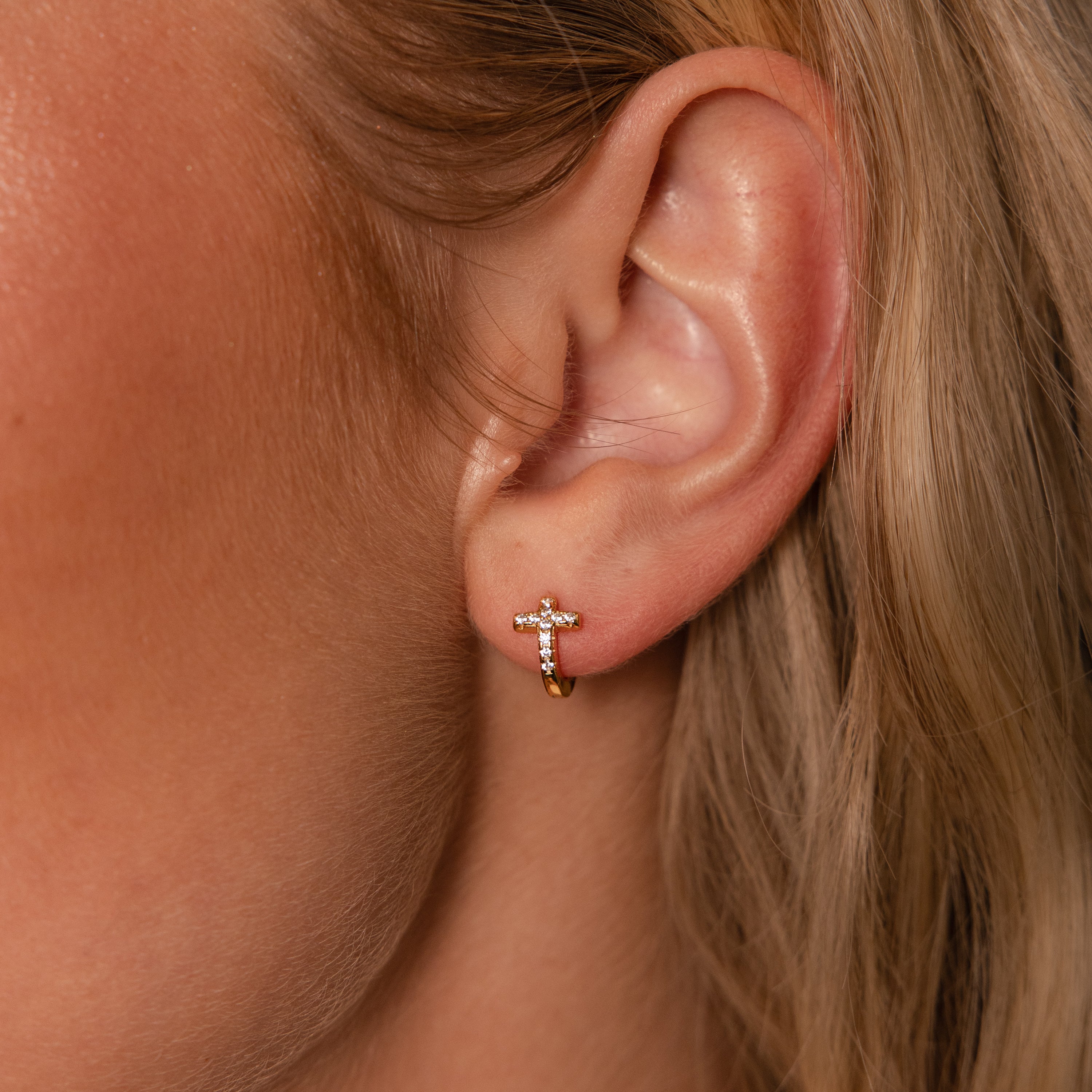 pavé earrings with a timeless symbol