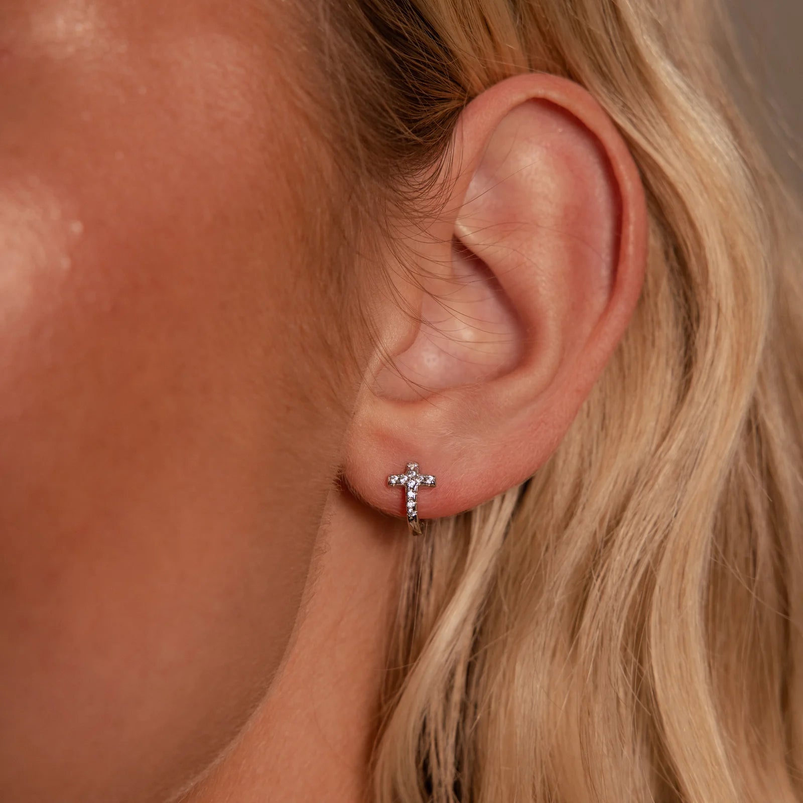 pavé earrings with a timeless symbol