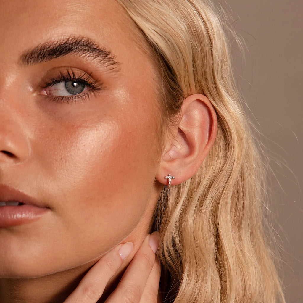 pavé earrings with a timeless symbol