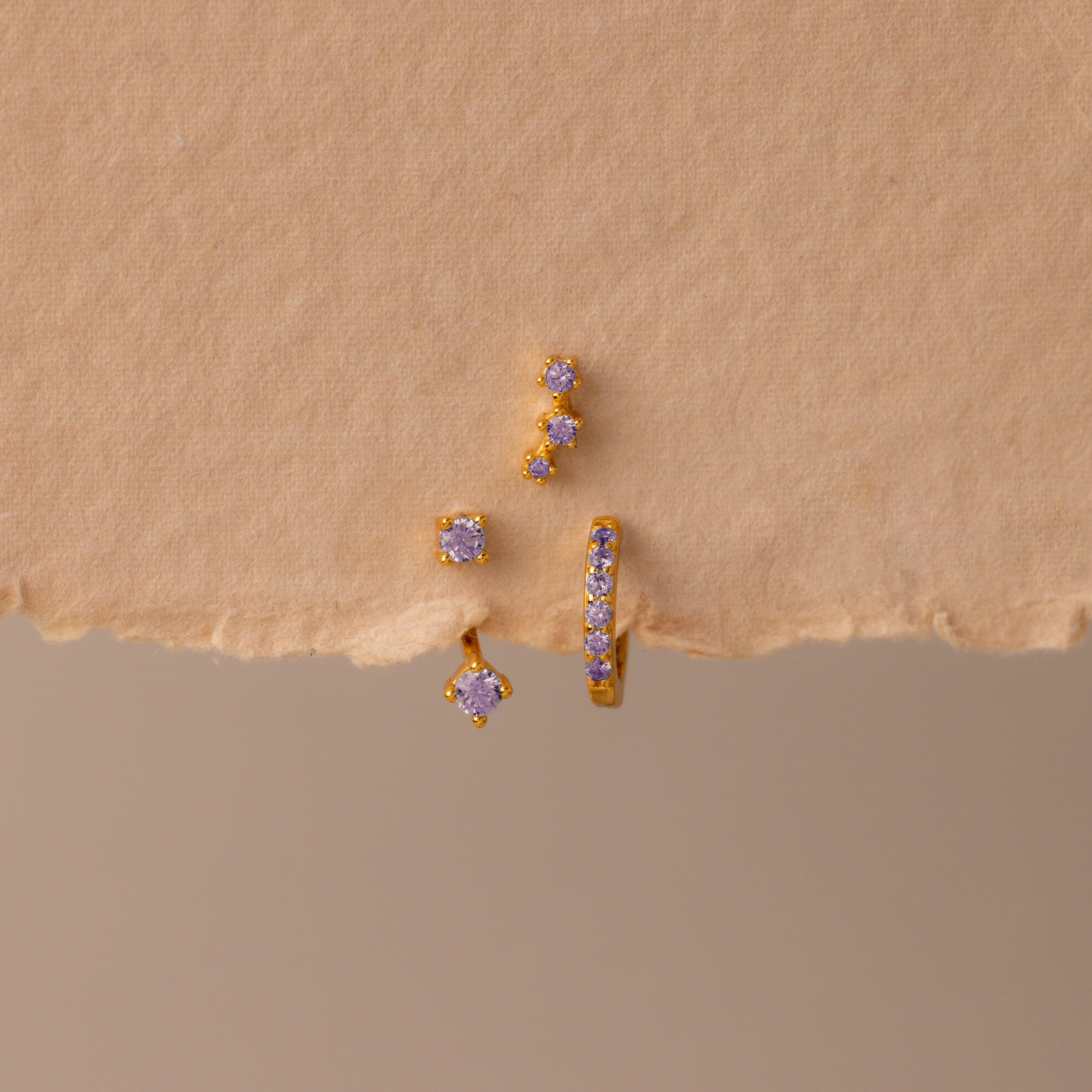 Set of colorful earrings with sparkling stones.