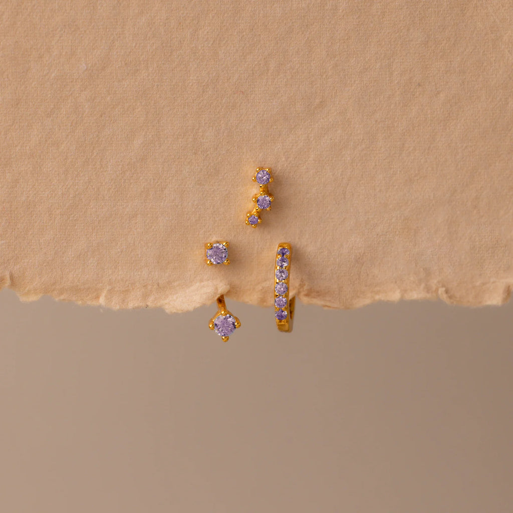 Set of colorful earrings with sparkling stones.