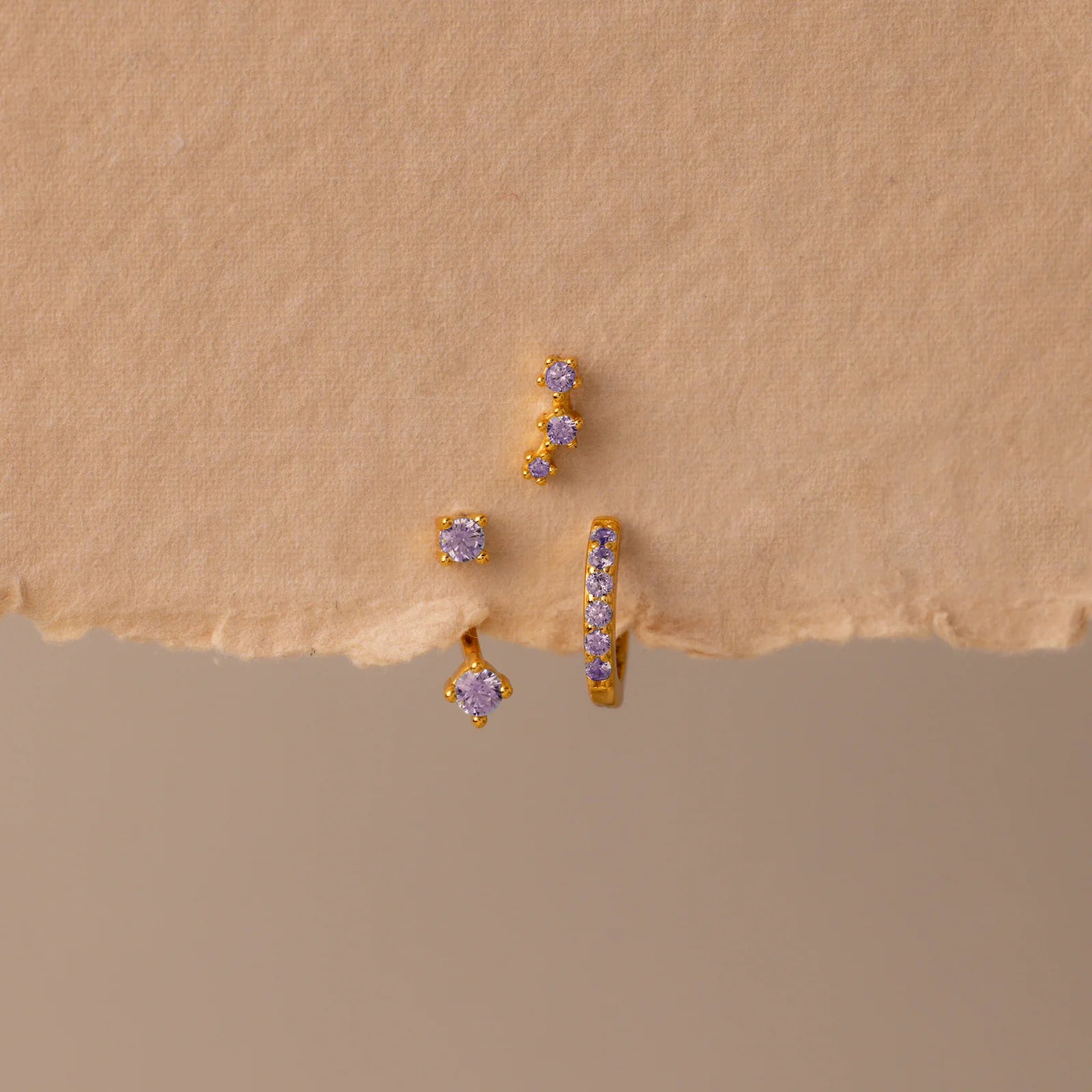 Set of colorful earrings with sparkling stones.
