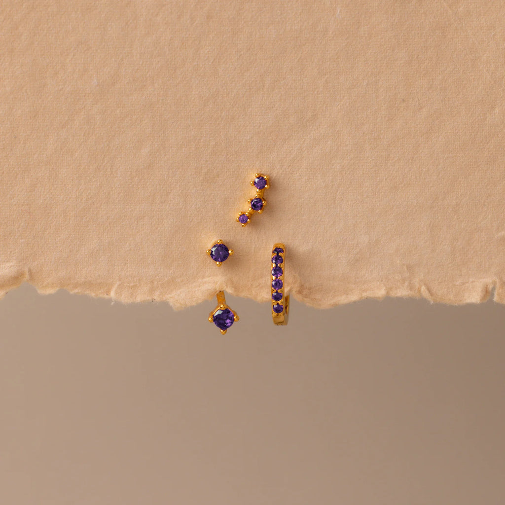 Set of colorful earrings with sparkling stones.