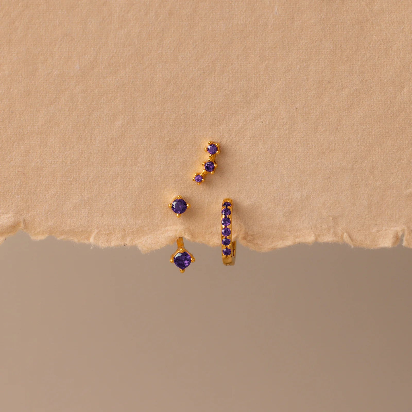 Set of colorful earrings with sparkling stones.