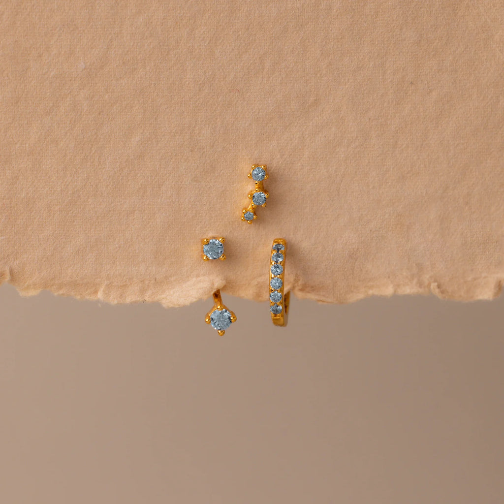 Set of colorful earrings with sparkling stones.