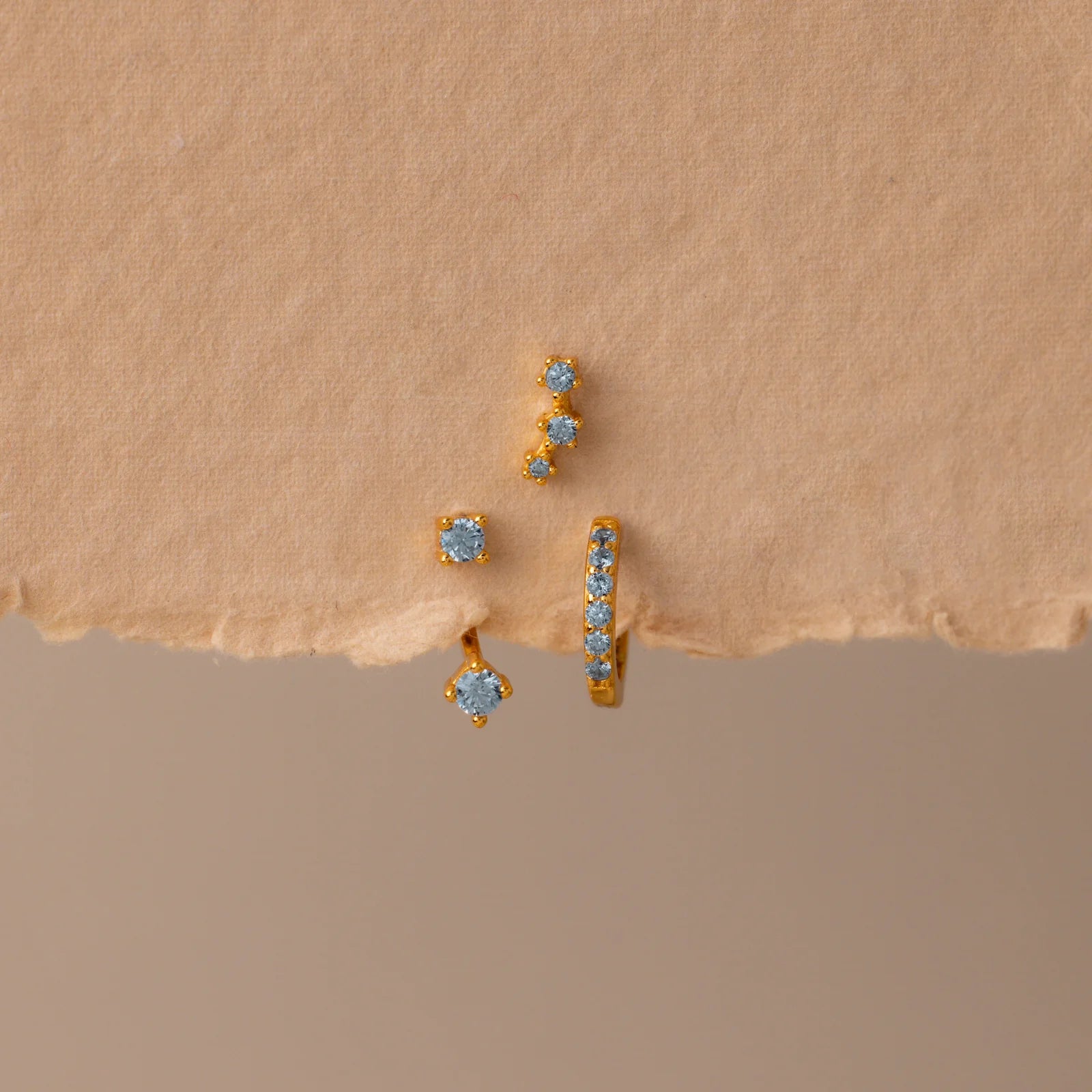 Set of colorful earrings with sparkling stones.