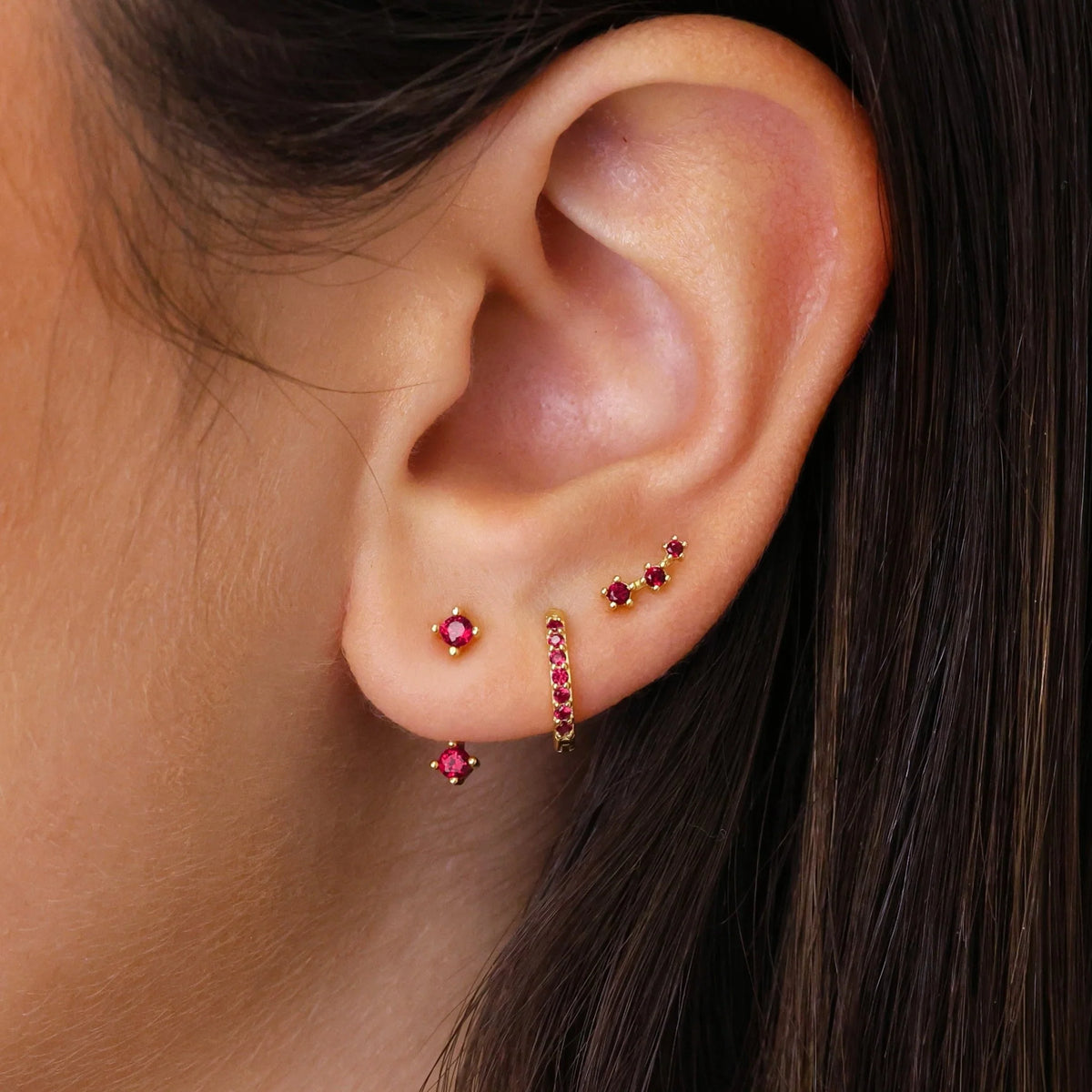 Set of colorful earrings with sparkling stones.