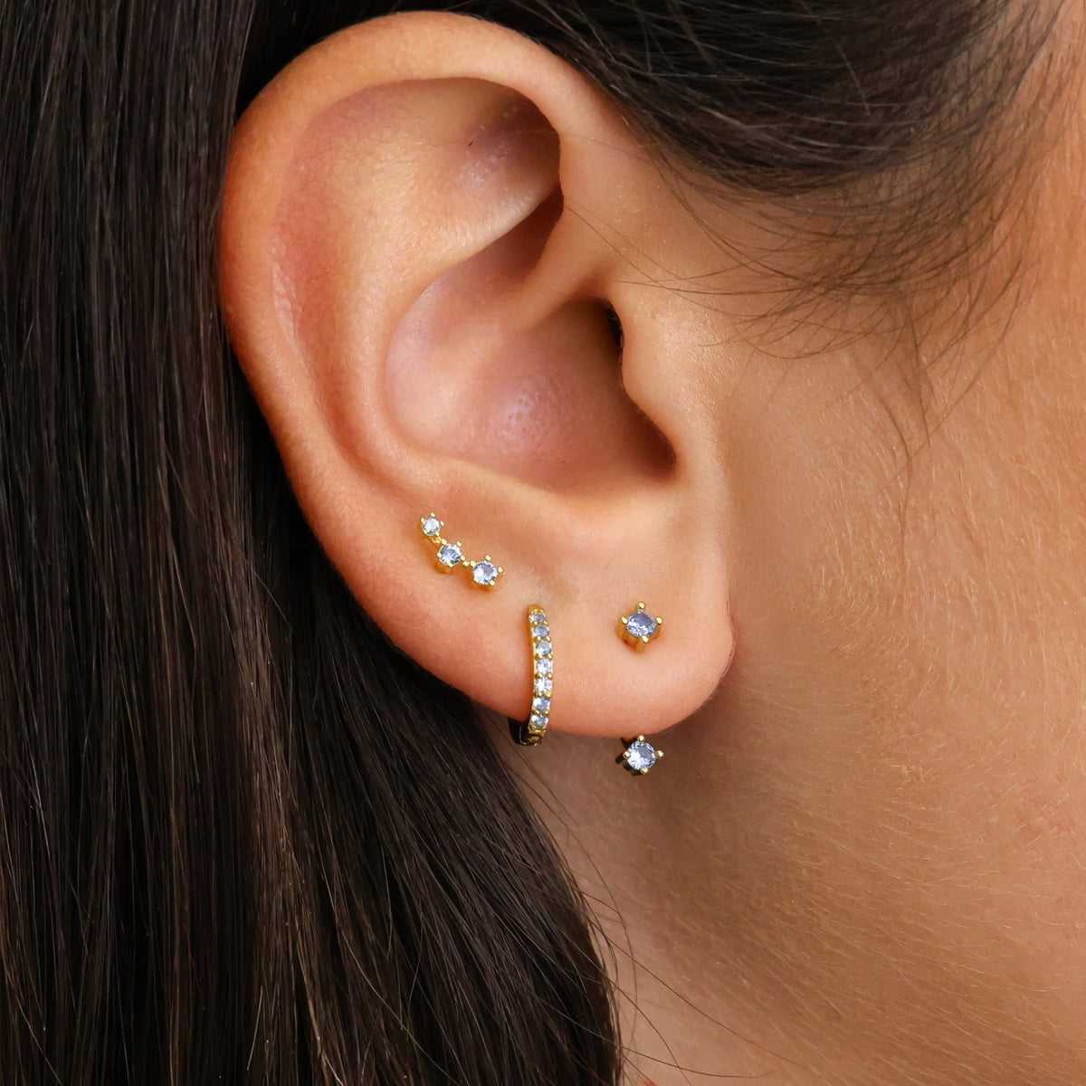 Set of colorful earrings with sparkling stones.