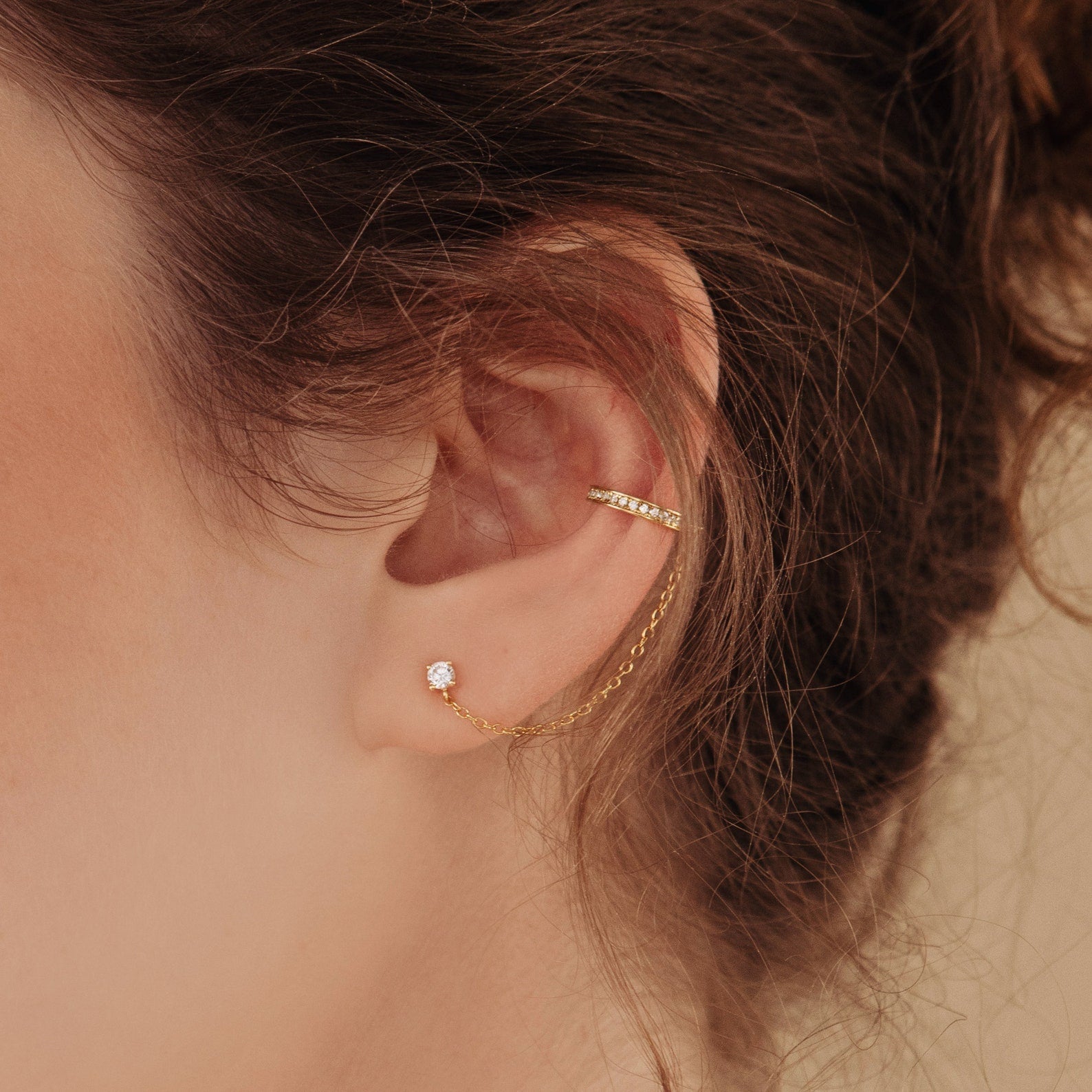 Ivy clip-on earrings with a sparkly chain.