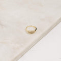 Ring with a studded surface