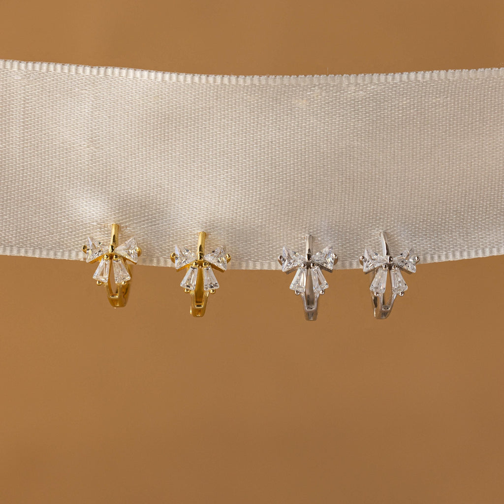 Little hoop earrings with a sparkly bow.