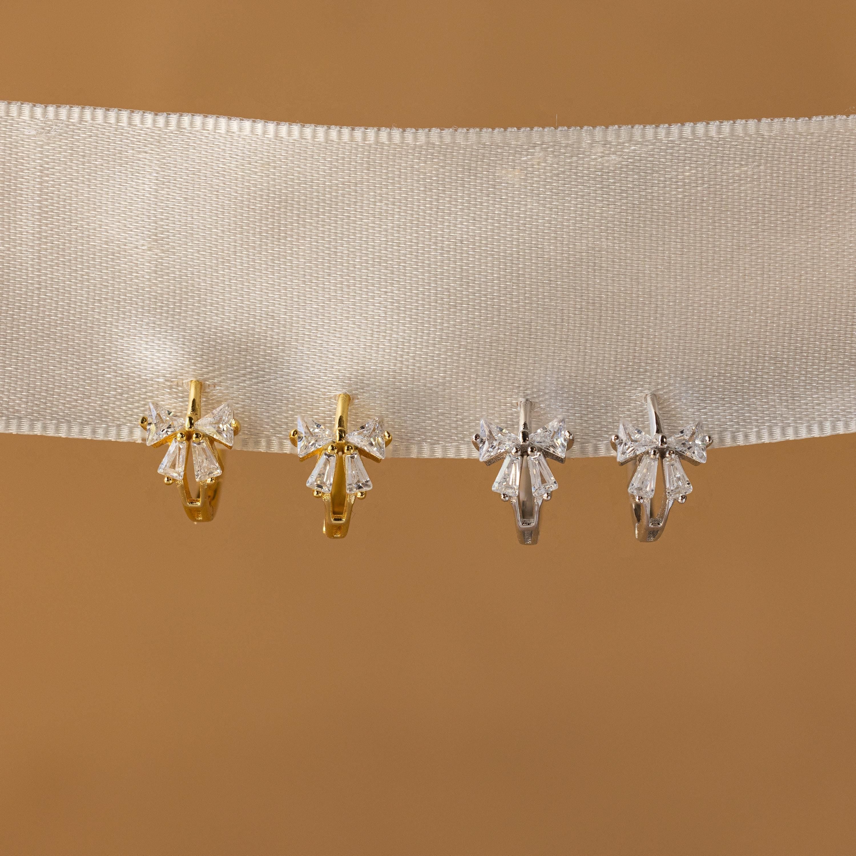 Little hoop earrings with a sparkly bow.