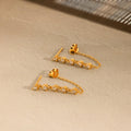 Zara earrings with chain in 18k gold.