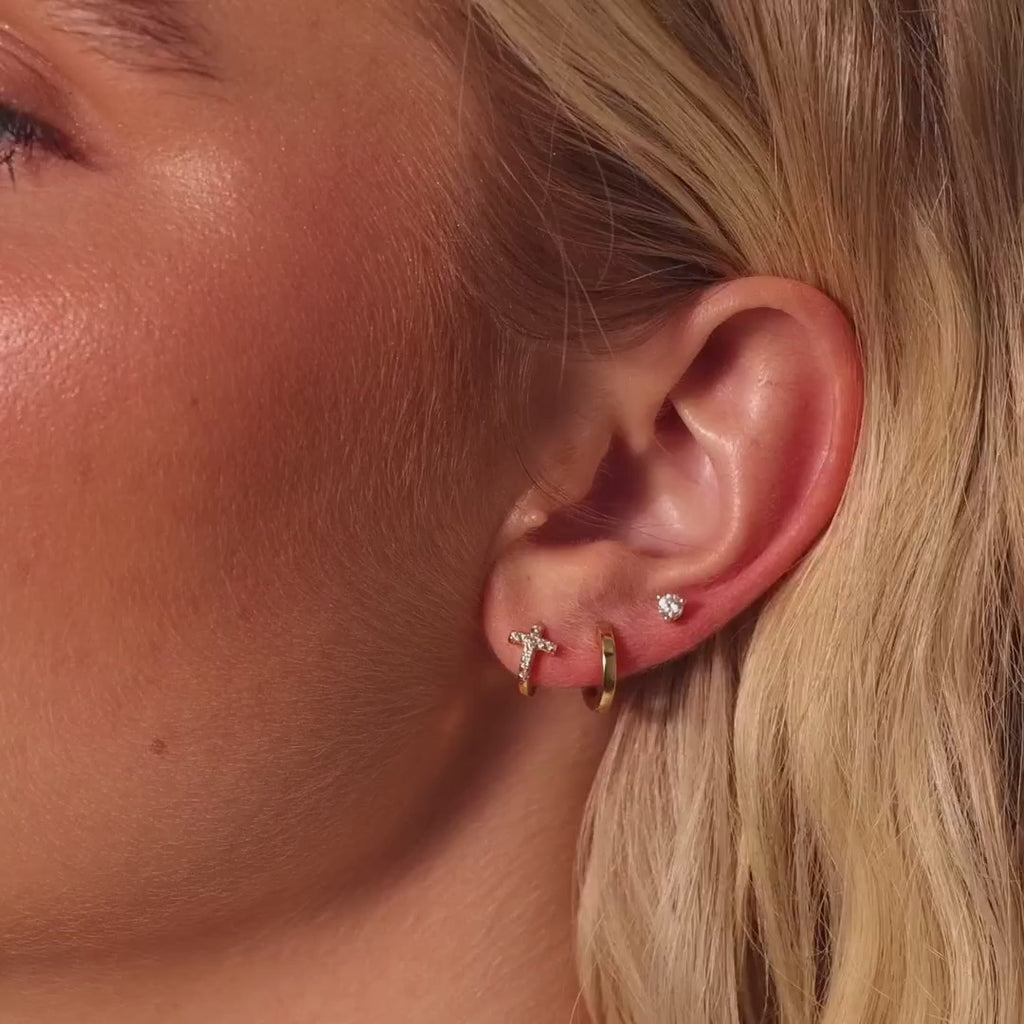 pavé earrings with a timeless symbol