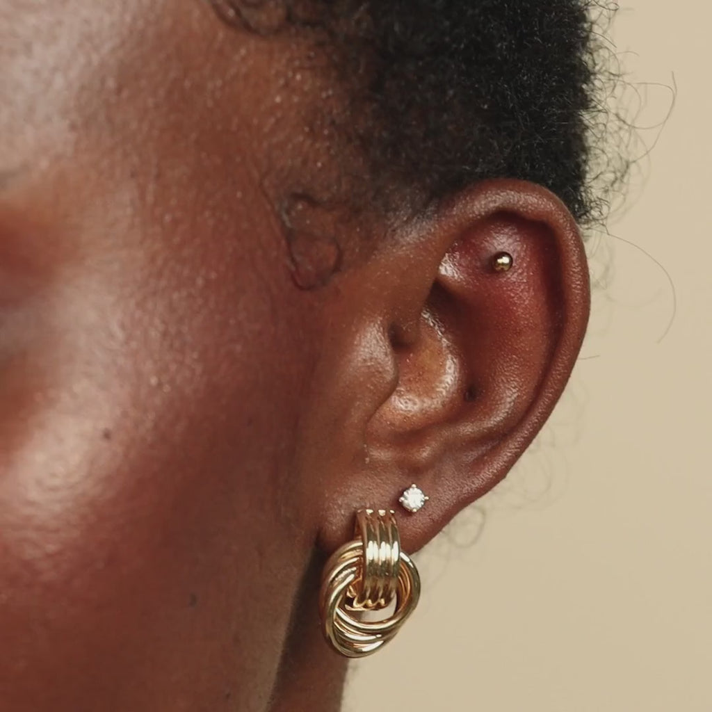 Knot earrings made of EVA foam.
