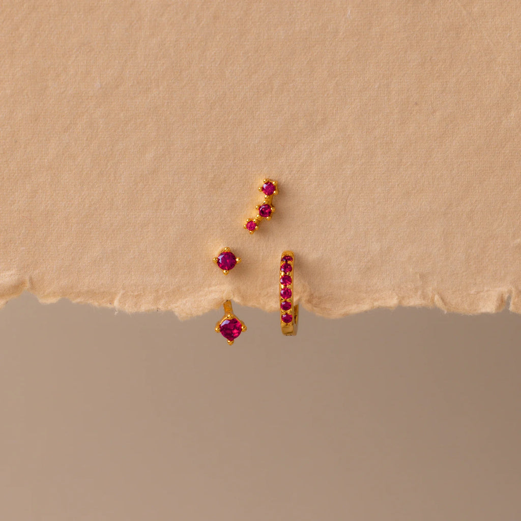 Set of colorful earrings with sparkling stones.