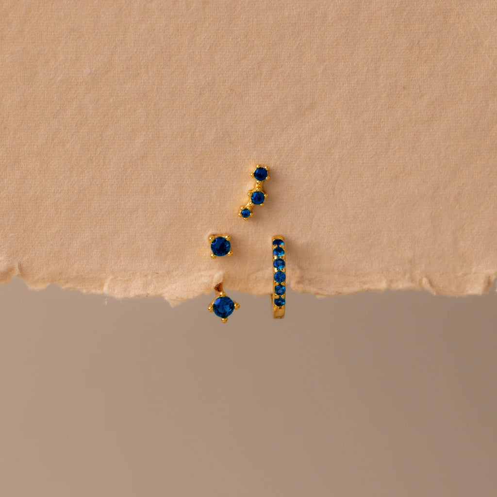 Set of colorful earrings with sparkling stones.