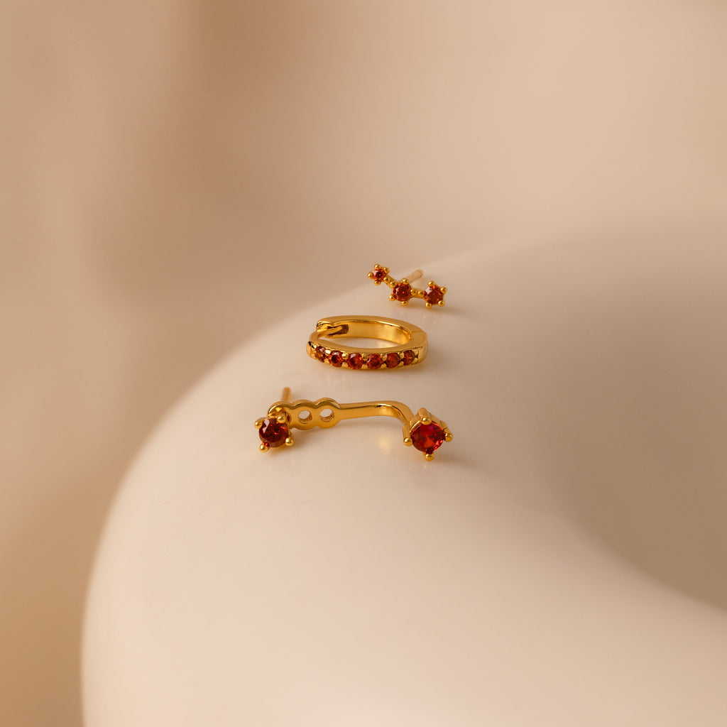 Set of colorful earrings with sparkling stones.