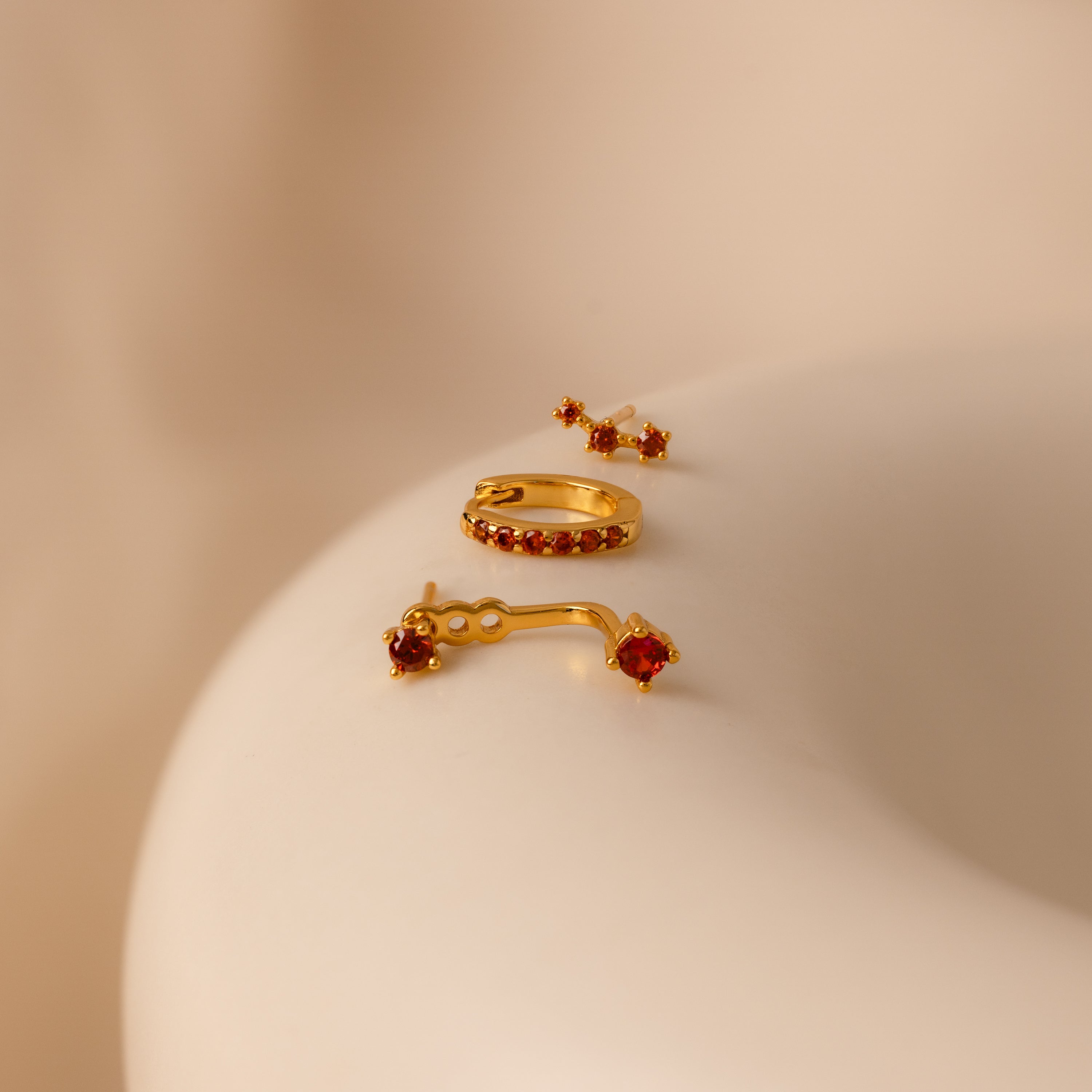 Set of colorful earrings with sparkling stones.