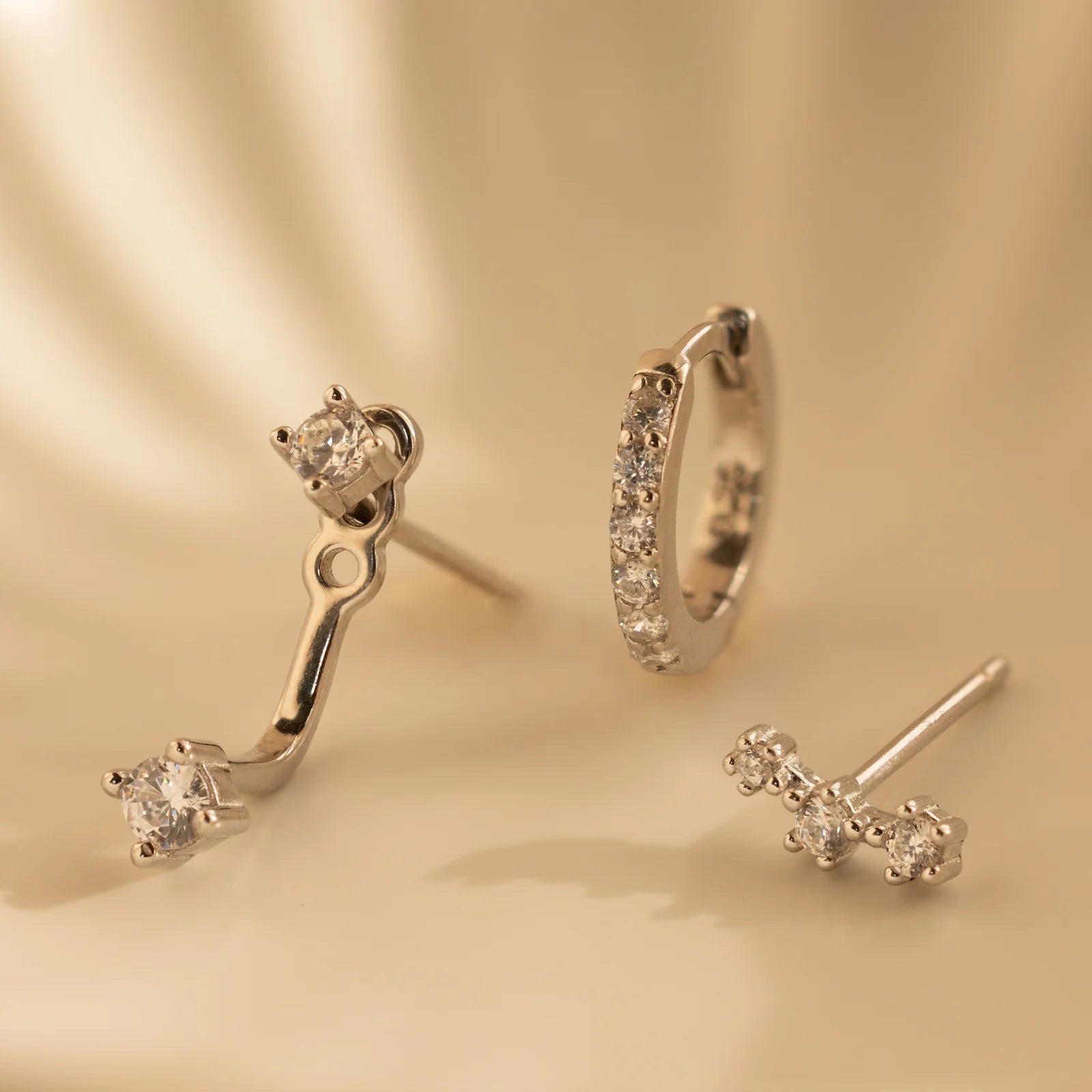 Set of colorful earrings with sparkling stones.
