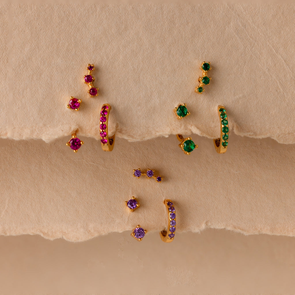 Set of colorful earrings with sparkling stones.