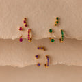 Set of colorful earrings with sparkling stones.