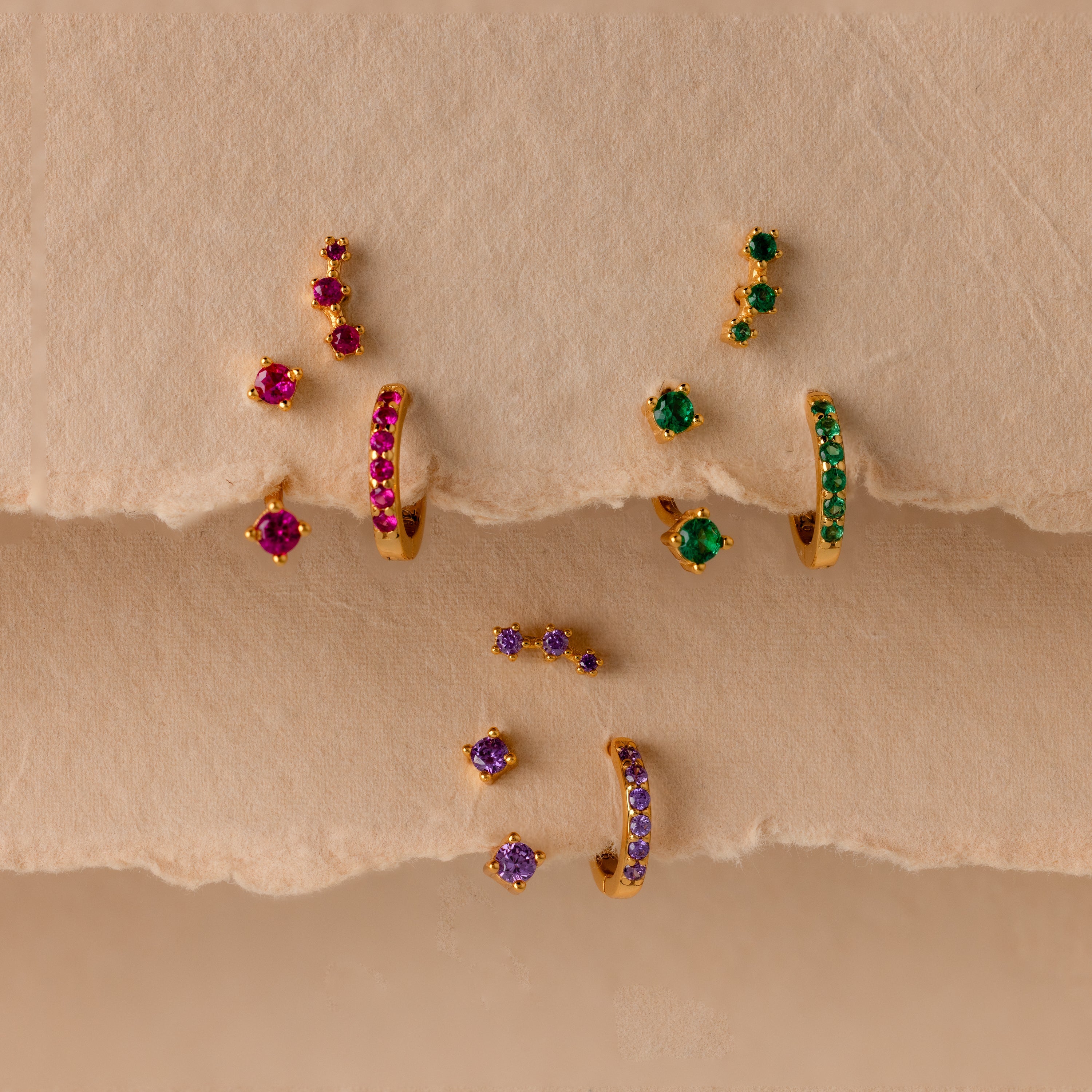 Set of colorful earrings with sparkling stones.