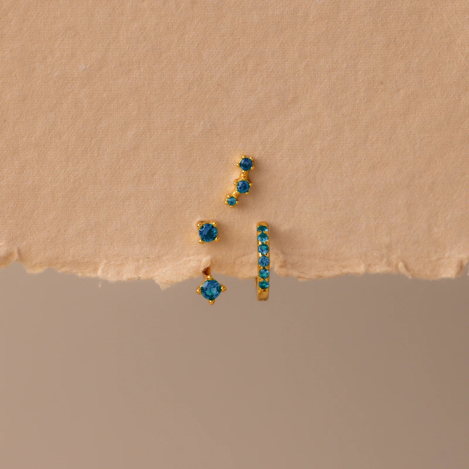 Set of colorful earrings with sparkling stones.